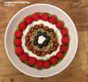 This video guides you through making an ultimate green smoothie bowl, blending kiwi, avocado, spinach, yogurt, coconut water, and honey.